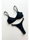 Чорний жіночий купальник на регуляторах з пірсингом